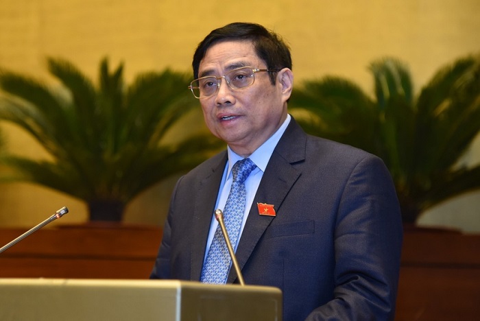 Thủ tướng Phạm Minh Chính trình bày báo cáo kinh tế - xã hội trước Quốc hội.